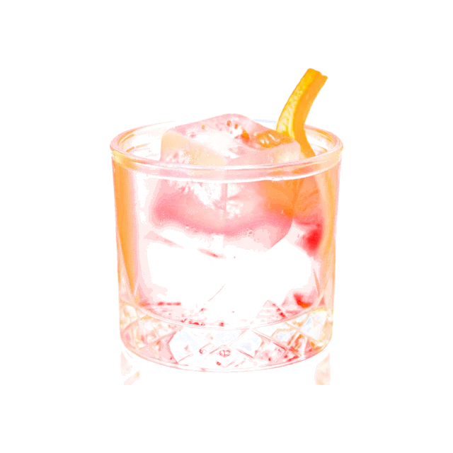 Studio photo of a Negroni in a rocks glass with an orange peel